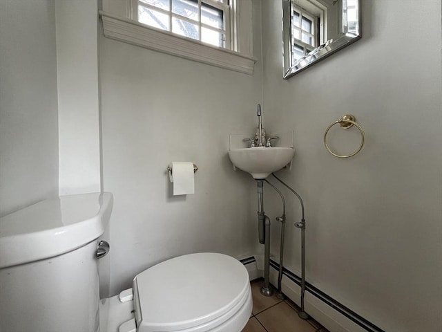 909 High St, Fall River, MA 02720 - bathroom with toilet, a baseboard heating unit, and tile patterned floors