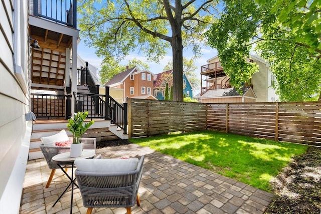 view of patio / terrace featuring stairway and a residential view