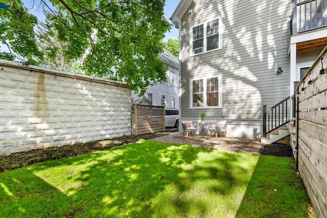 rear view of house featuring a patio area and stairs