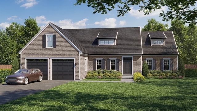 cape cod house featuring a front yard and a garage