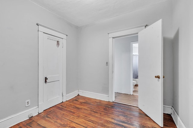 spare room featuring hardwood / wood-style floors