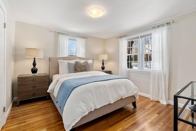 bedroom with light hardwood / wood-style flooring