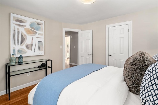 bedroom with hardwood / wood-style flooring