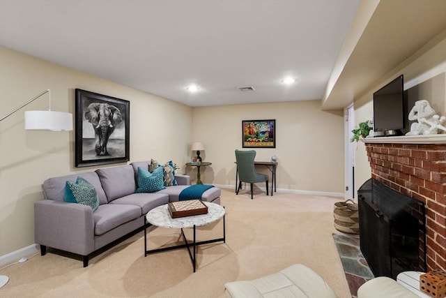 living room with light carpet and a brick fireplace