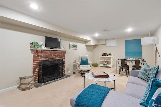 carpeted living room with a fireplace