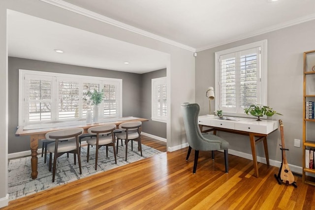 office featuring crown molding, hardwood / wood-style floors, and a wealth of natural light