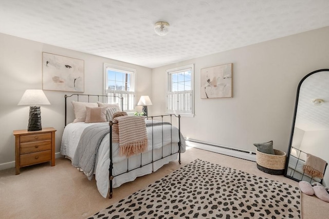 bedroom featuring light carpet, baseboards, and a baseboard radiator