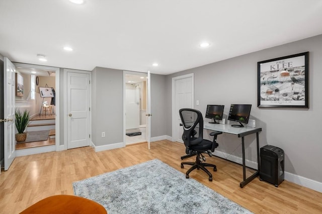 office space featuring recessed lighting, wood finished floors, and baseboards