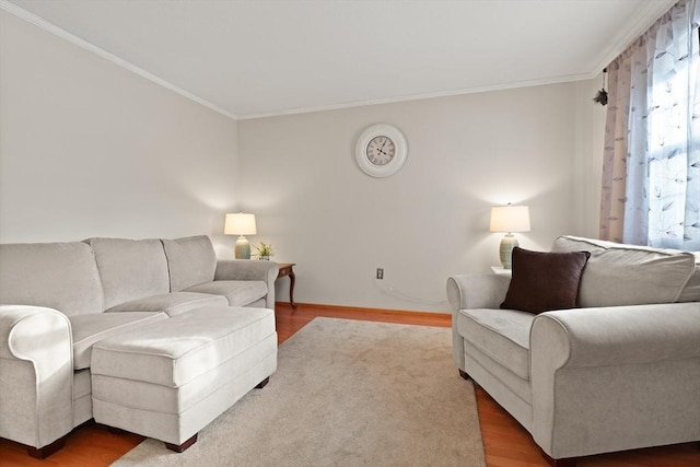 living area with crown molding and wood finished floors