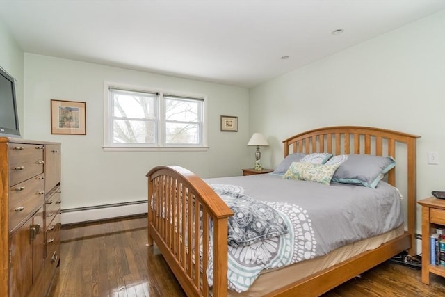 bedroom featuring a baseboard radiator and dark wood finished floors