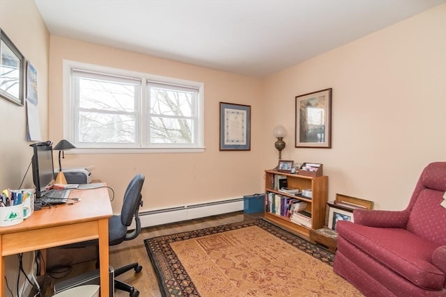 office space featuring baseboard heating and wood finished floors