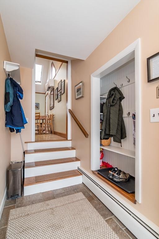 mudroom featuring baseboard heating and baseboards