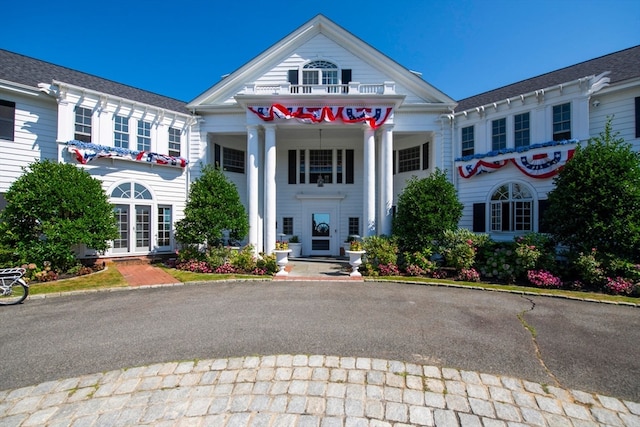 greek revival inspired property with french doors