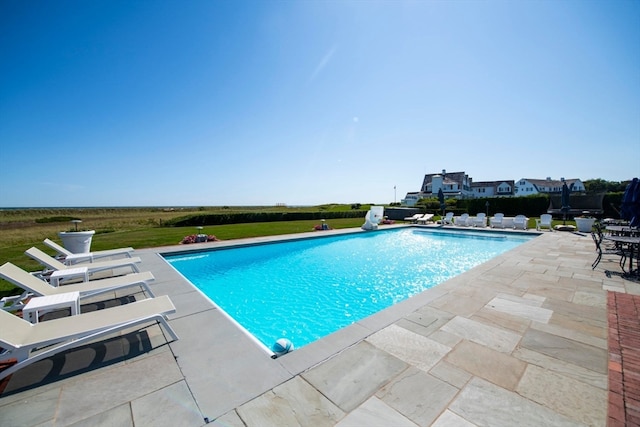 view of swimming pool with a patio area