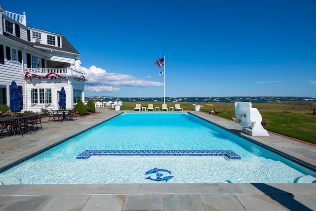 view of swimming pool featuring a patio area