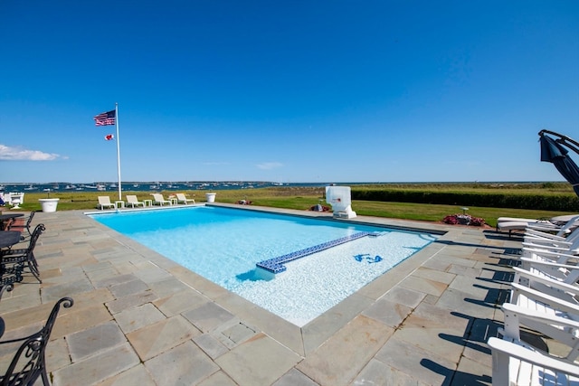 view of swimming pool with a patio area