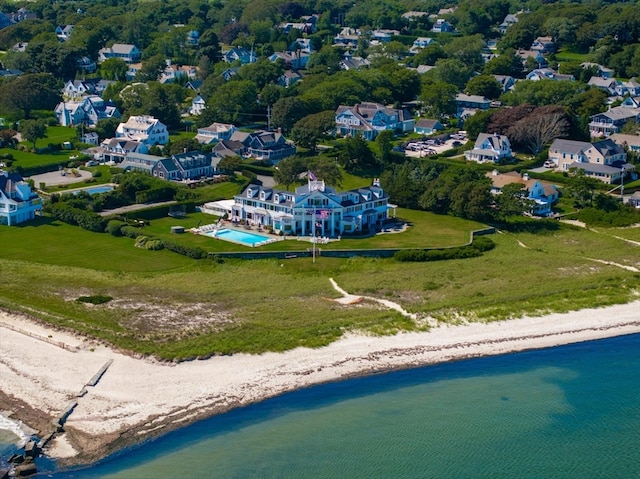 bird's eye view featuring a water view and a beach view