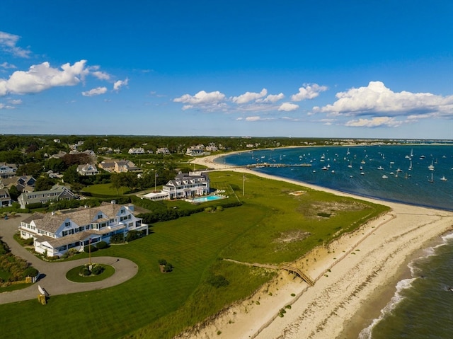 bird's eye view with a water view and a beach view