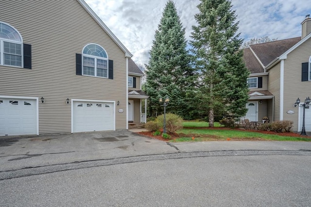 view of front facade with driveway and an attached garage