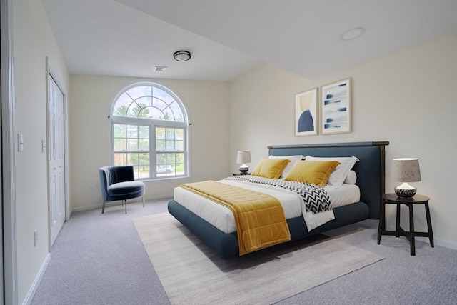 bedroom featuring baseboards, visible vents, and carpet floors