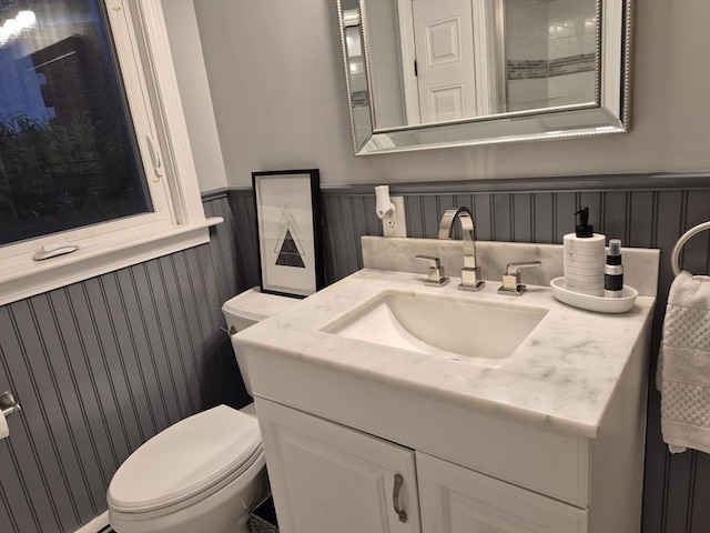2 Neponset Pl, Canton, MA 02021 - bathroom with wainscoting, toilet, and vanity