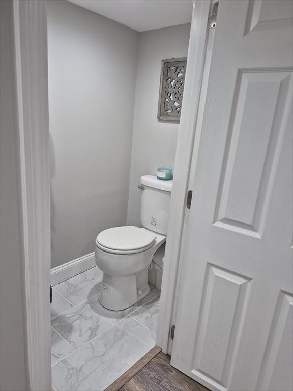2 Neponset Pl, Canton, MA 02021 - bathroom featuring toilet, baseboards, and marble finish flooring