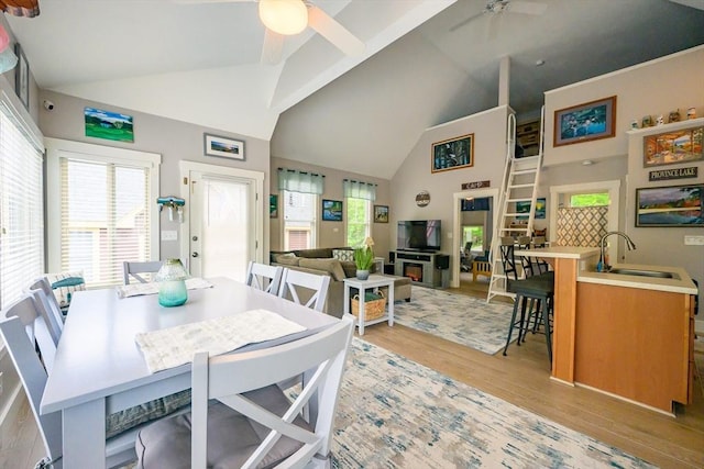16 White Pine Knl Unit 199, Westford, MA 01886 - dining room with ceiling fan, light wood-style floors, high vaulted ceiling, and healthy amount of natural light