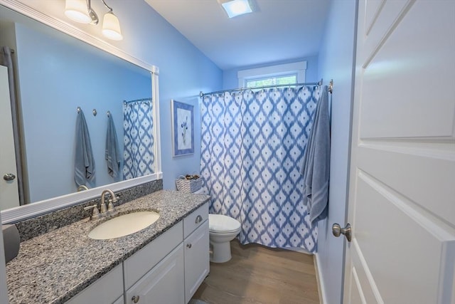 16 White Pine Knl Unit 199, Westford, MA 01886 - full bath with wood finished floors, toilet, vanity, and a shower with curtain