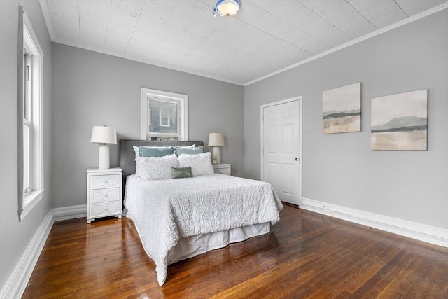 bedroom featuring ornamental molding and dark hardwood / wood-style floors