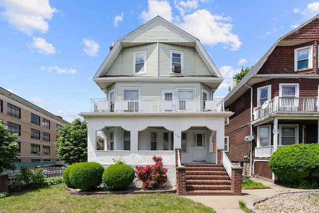 562 Broadway, Everett, MA 02149 - colonial inspired home with a balcony and a gambrel roof