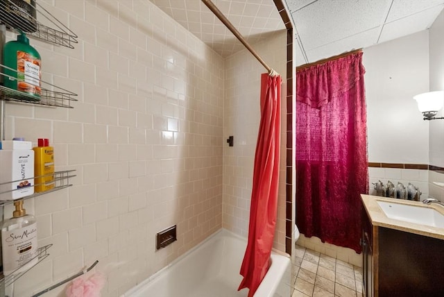 562 Broadway, Everett, MA 02149 - bathroom with shower / bath combo, tile walls, and vanity