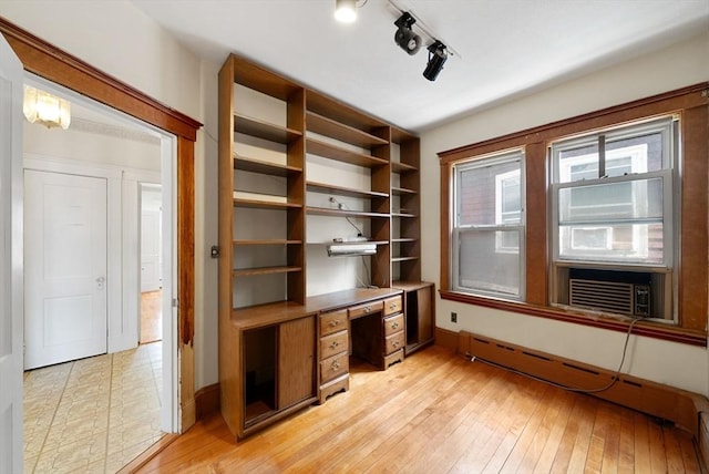 562 Broadway, Everett, MA 02149 - unfurnished office with a baseboard radiator, cooling unit, and light wood-style floors