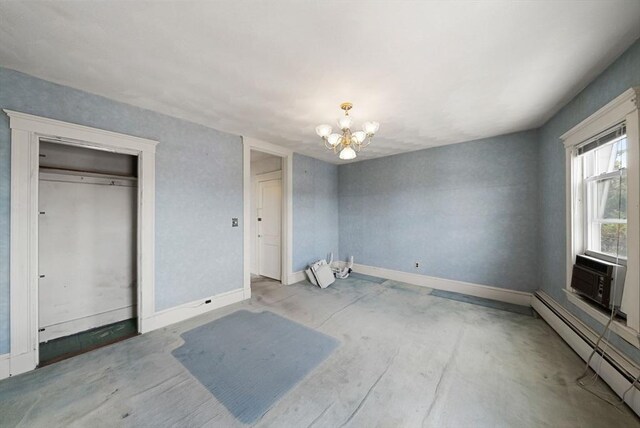 562 Broadway, Everett, MA 02149 - unfurnished bedroom with baseboard heating, a chandelier, unfinished concrete floors, and cooling unit