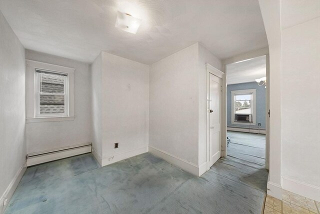562 Broadway, Everett, MA 02149 - carpeted spare room featuring baseboard heating, a baseboard radiator, and cooling unit