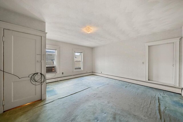 562 Broadway, Everett, MA 02149 - spare room with a baseboard radiator, carpet floors, and cooling unit