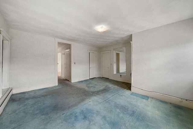 562 Broadway, Everett, MA 02149 - carpeted empty room with a baseboard radiator