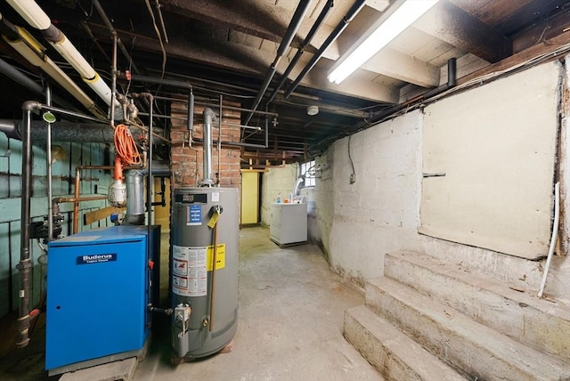 562 Broadway, Everett, MA 02149 - unfinished below grade area featuring gas water heater, a heating unit, and washer / clothes dryer