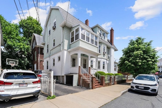 562 Broadway, Everett, MA 02149 - view of front facade with a chimney and a gate