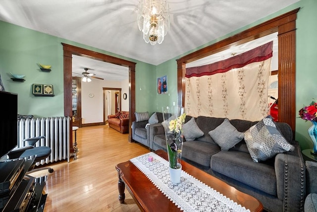 562 Broadway, Everett, MA 02149 - living room with wood finished floors, radiator heating unit, and ceiling fan