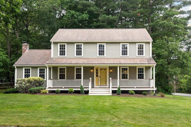 300 Maple St, Franklin, MA 02038 - colonial-style house featuring a chimney, a front lawn, covered porch, and roof with shingles