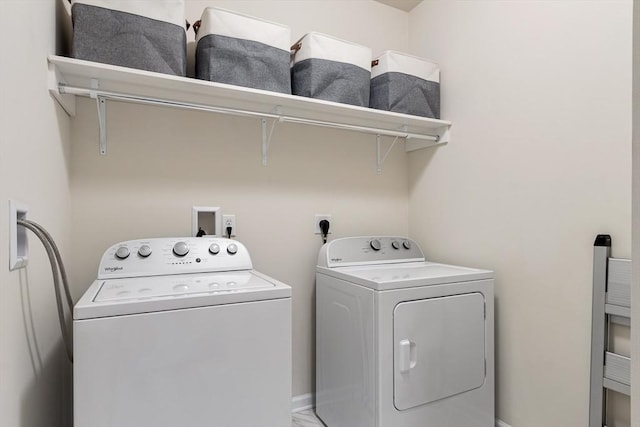 laundry room with separate washer and dryer