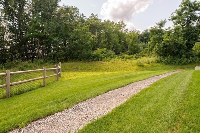 view of home's community with a lawn