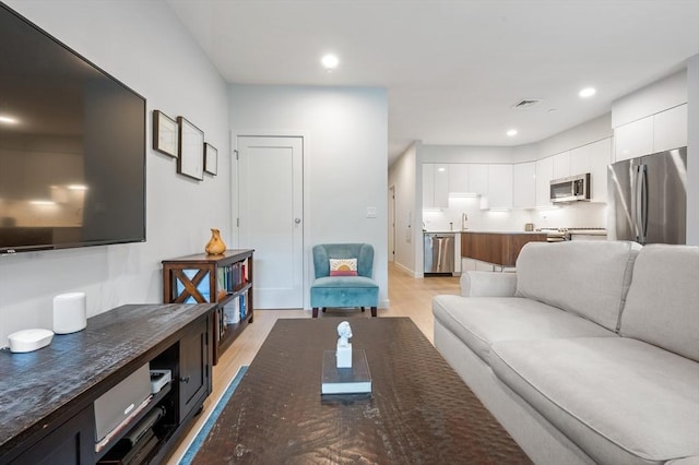7 Lisbon St Unit 201, Boston, MA 02128 - living area featuring light wood-type flooring and recessed lighting