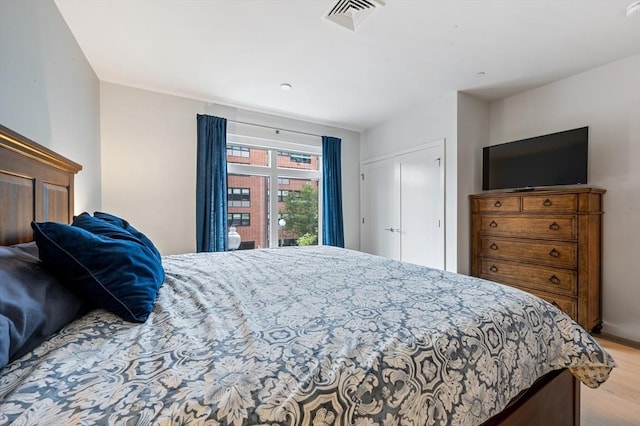 7 Lisbon St Unit 201, Boston, MA 02128 - bedroom with wood finished floors and access to exterior