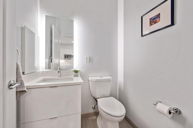 7 Lisbon St Unit 201, Boston, MA 02128 - half bathroom featuring vanity and toilet