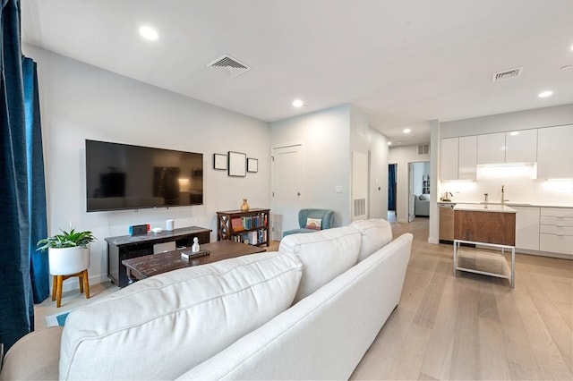 7 Lisbon St Unit 201, Boston, MA 02128 - living area featuring light wood finished floors and recessed lighting