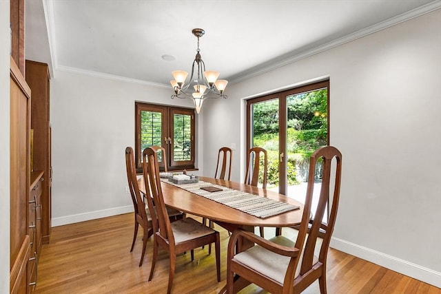 34 Lagrange St, Brookline, MA 02467 - dining room with french doors, healthy amount of natural light, a chandelier, light wood-type flooring, and crown molding