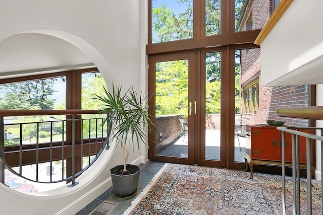 34 Lagrange St, Brookline, MA 02467 - doorway to outside featuring arched walkways and a high ceiling