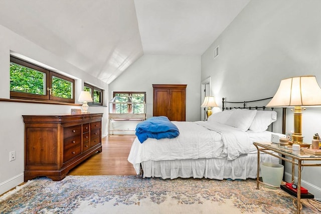 34 Lagrange St, Brookline, MA 02467 - bedroom with multiple windows, wood finished floors, and vaulted ceiling