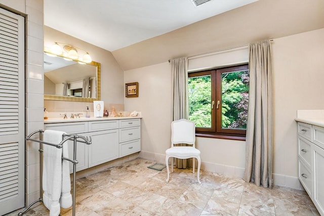 34 Lagrange St, Brookline, MA 02467 - bathroom with vanity and lofted ceiling